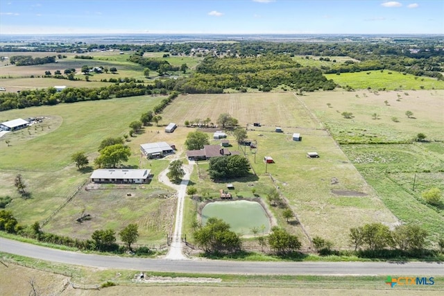 birds eye view of property featuring a rural view