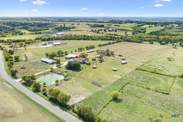 aerial view with a rural view and a water view