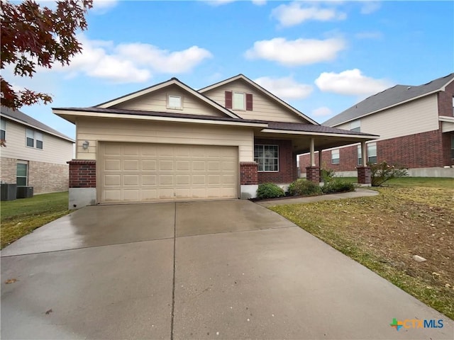 view of front of home with a garage and a front lawn