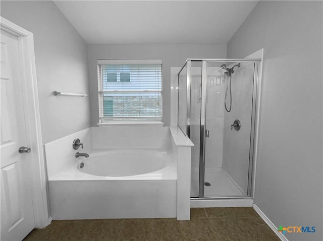 bathroom with plus walk in shower, tile patterned flooring, and lofted ceiling