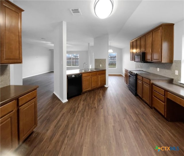 kitchen featuring decorative backsplash, sink, electric range, black dishwasher, and dark hardwood / wood-style floors