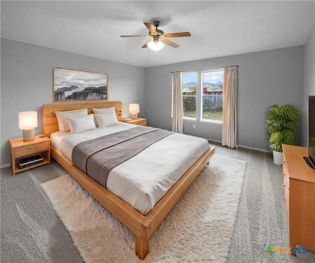 carpeted bedroom with ceiling fan