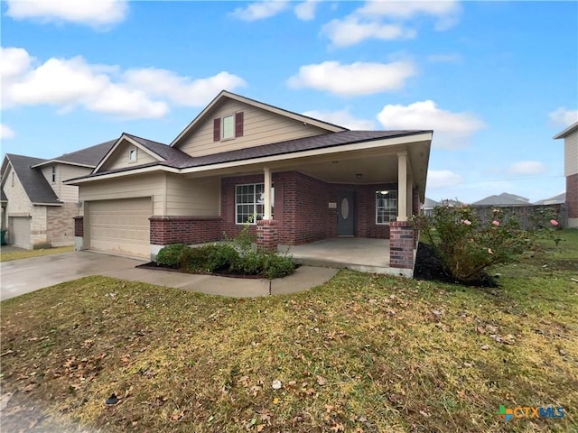 view of front of property featuring a front yard and a garage