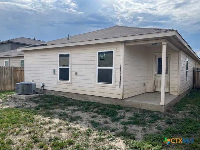 1421 Breanna Ln, Kyle, TX 78640 - back of property featuring fence and central AC