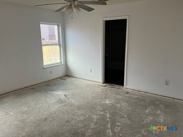 1421 Breanna Ln, Kyle, TX 78640 - empty room with a ceiling fan and concrete floors