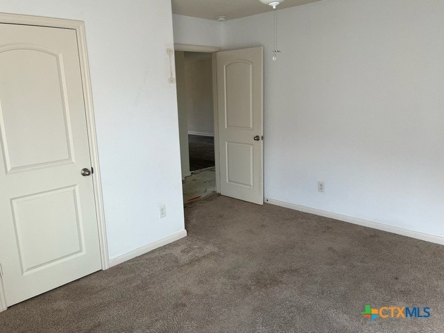 1421 Breanna Ln, Kyle, TX 78640 - unfurnished bedroom featuring carpet and baseboards