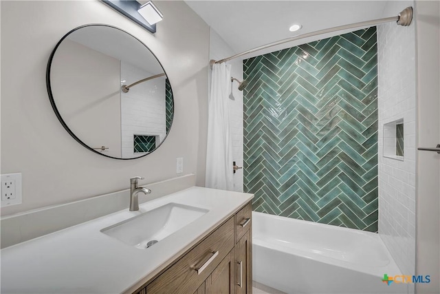 bathroom with shower / tub combo and vanity