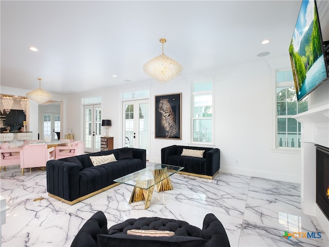 living room with marble finish floor, french doors, a fireplace, and crown molding