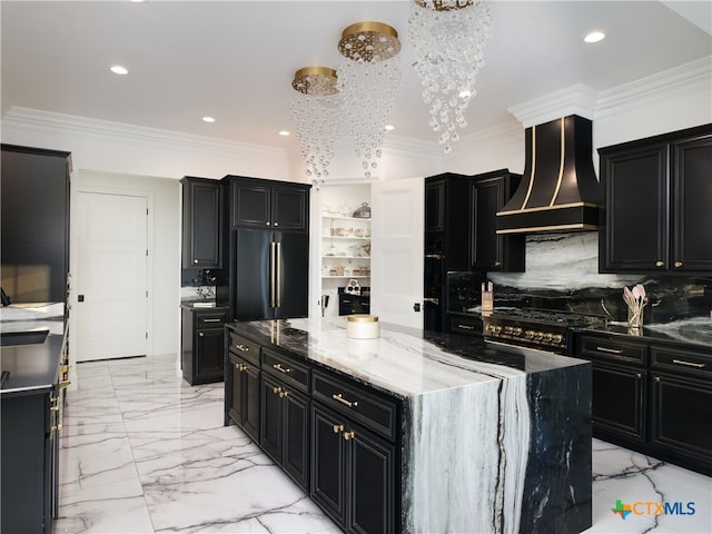 kitchen with custom exhaust hood, high end black fridge, and dark cabinets