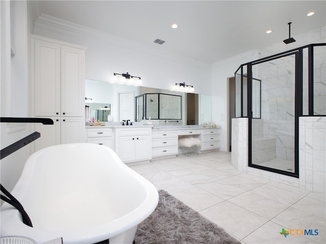 bathroom featuring visible vents, a shower stall, crown molding, a soaking tub, and vanity