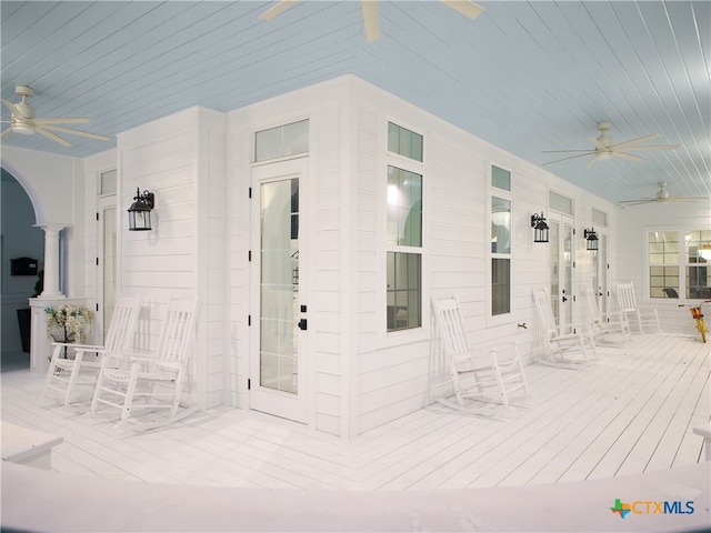 view of patio with a porch and a ceiling fan