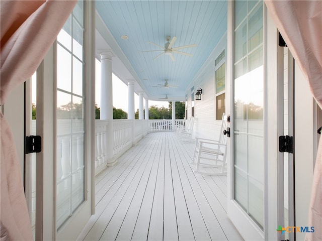 deck with a porch and a ceiling fan