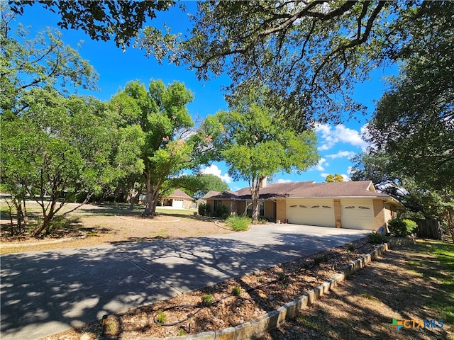 ranch-style home featuring a garage