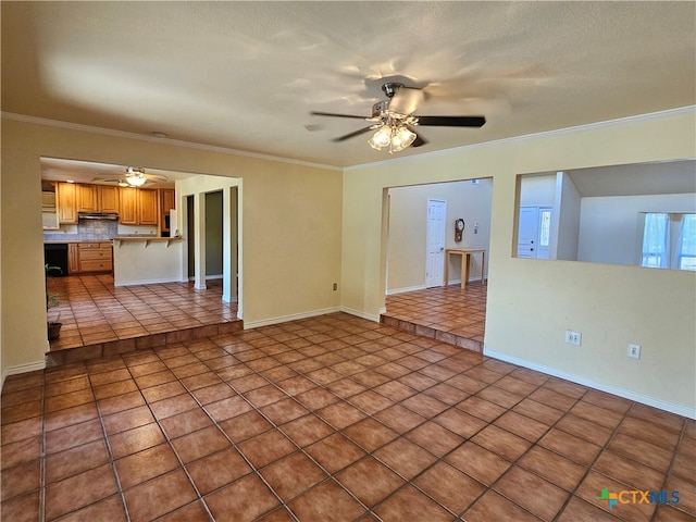 tiled empty room with ceiling fan, a textured ceiling, and crown molding