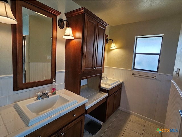 bathroom with vanity and tile patterned floors