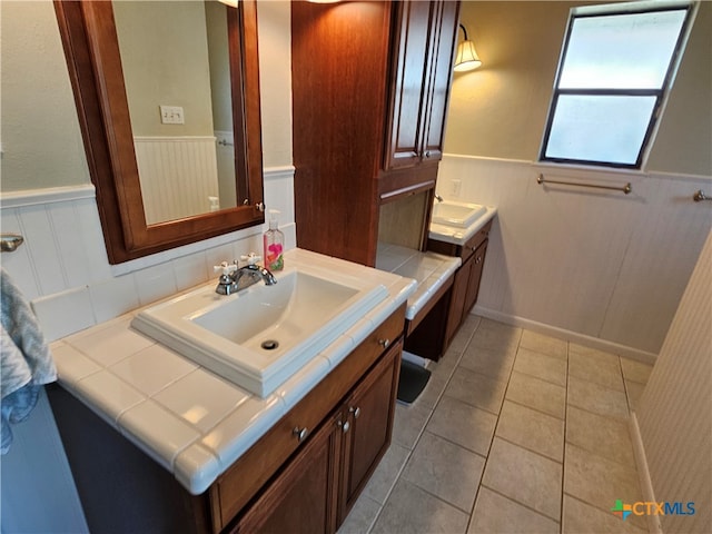 bathroom with vanity and tile patterned flooring