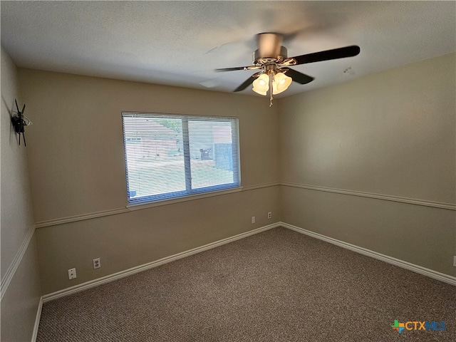 spare room with a textured ceiling, ceiling fan, and carpet floors