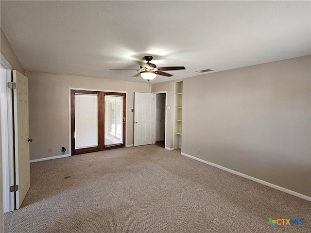 unfurnished bedroom featuring carpet, ceiling fan, and access to exterior