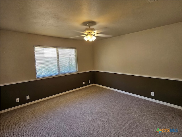 carpeted empty room with a textured ceiling and ceiling fan