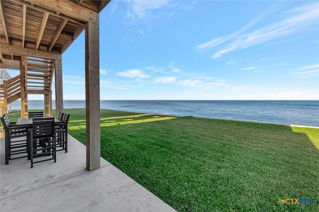 view of yard featuring a water view and a patio