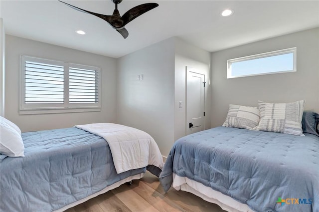 bedroom featuring hardwood / wood-style floors and ceiling fan