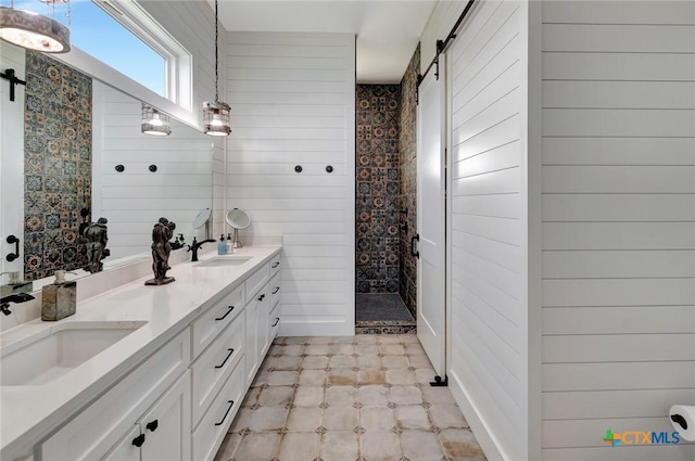 bathroom with vanity, wood walls, and walk in shower