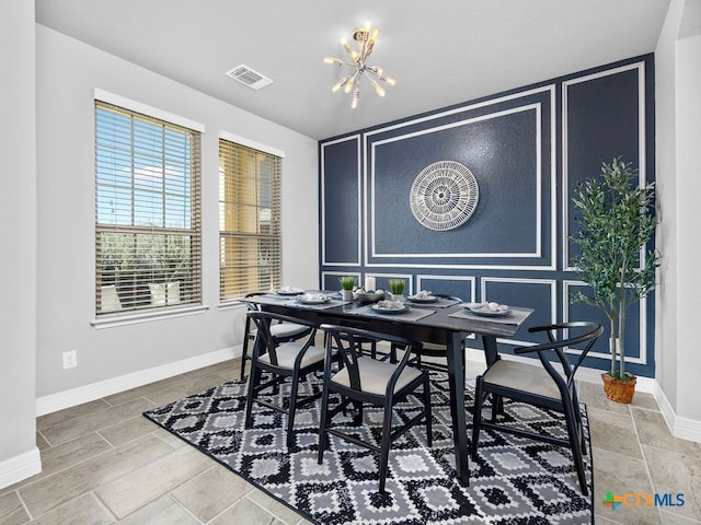 dining area featuring a chandelier