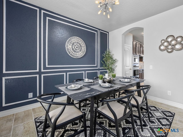 dining room with a textured ceiling