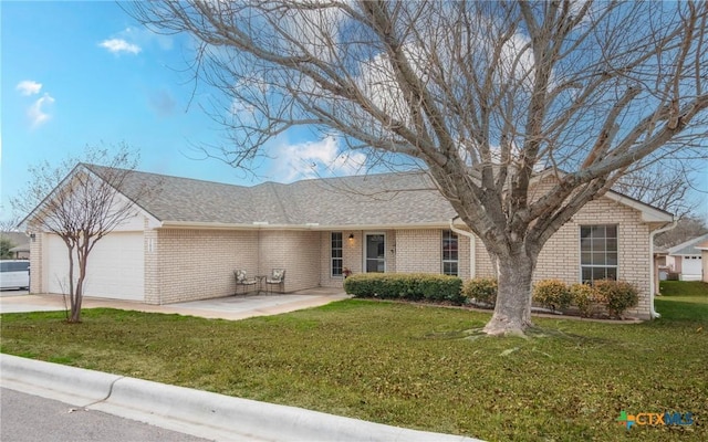 ranch-style house with a garage and a front lawn