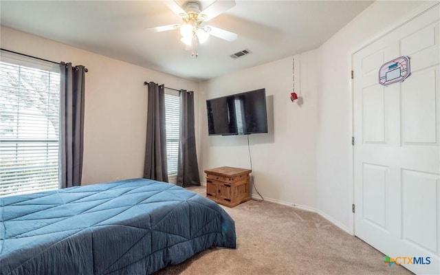 carpeted bedroom featuring ceiling fan