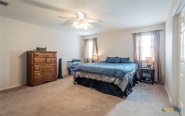 carpeted bedroom with ceiling fan