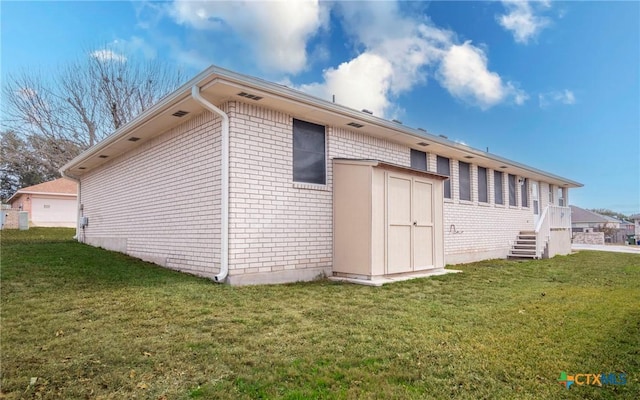 view of side of home with a lawn