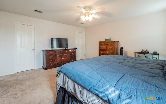 bedroom featuring ceiling fan and light colored carpet