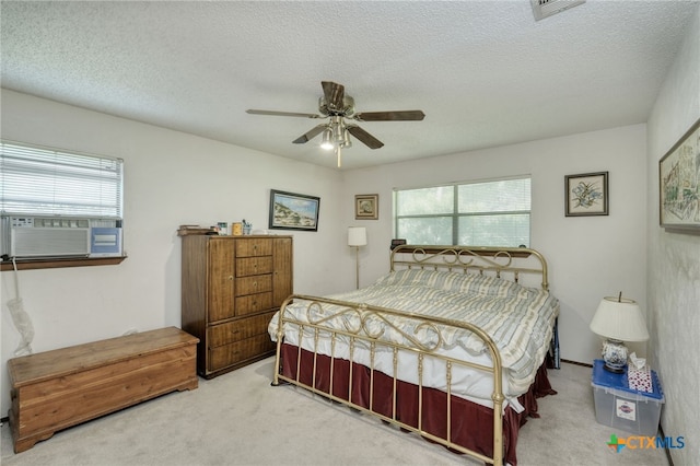 1104 Saint Williams Ave, Round Rock, TX 78681 - bedroom with carpet flooring, cooling unit, multiple windows, and a textured ceiling