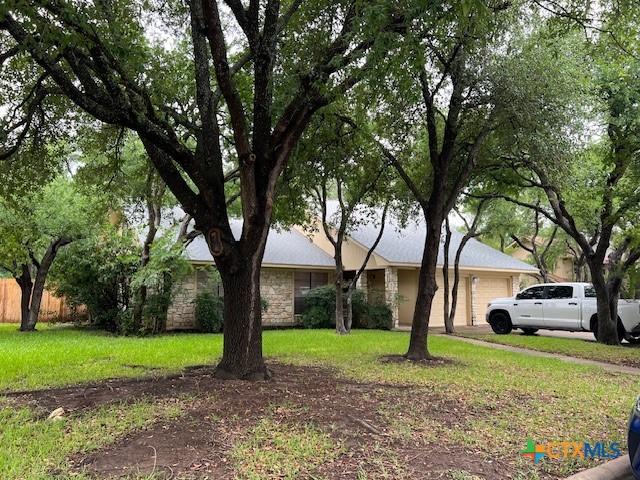 1104 Saint Williams Ave, Round Rock, TX 78681 - view of front facade with an attached garage and stone siding