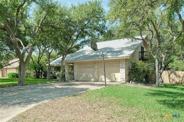 1104 Saint Williams Ave, Round Rock, TX 78681 - view of front of house with stone siding, a garage, and concrete driveway