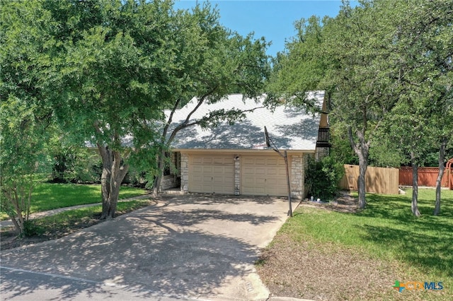 1104 Saint Williams Ave, Round Rock, TX 78681 - view of front of house featuring stone siding, a garage, and driveway