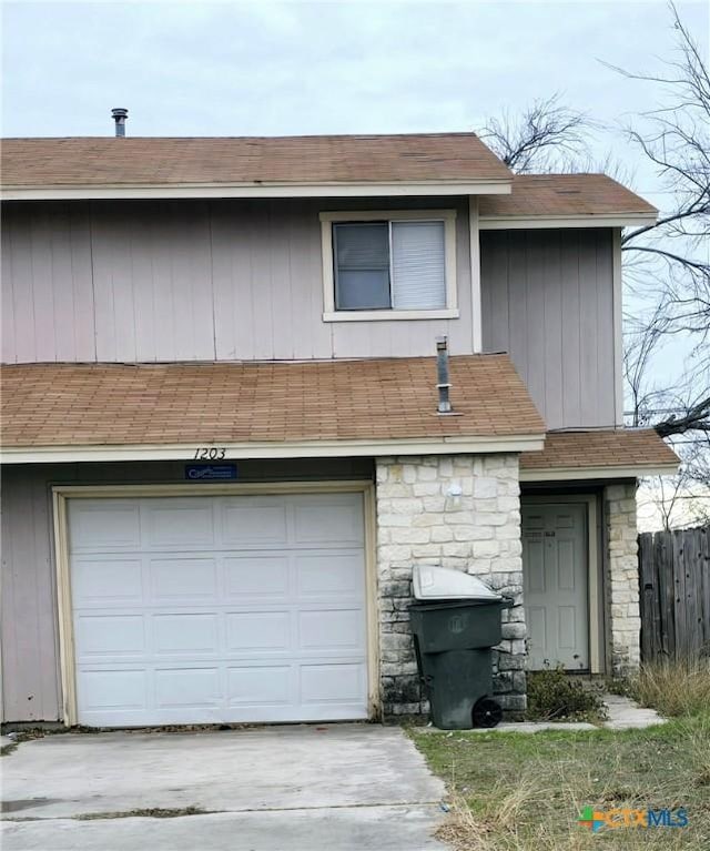 view of front of property with a garage