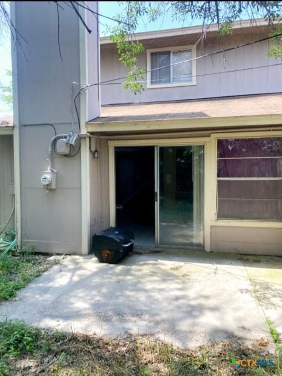 entrance to property with a patio area