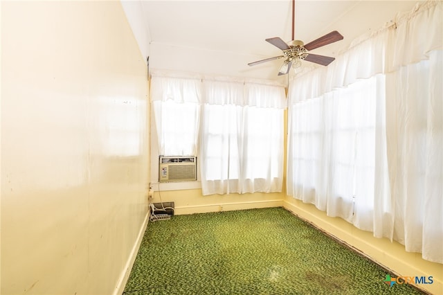 unfurnished sunroom featuring cooling unit and ceiling fan