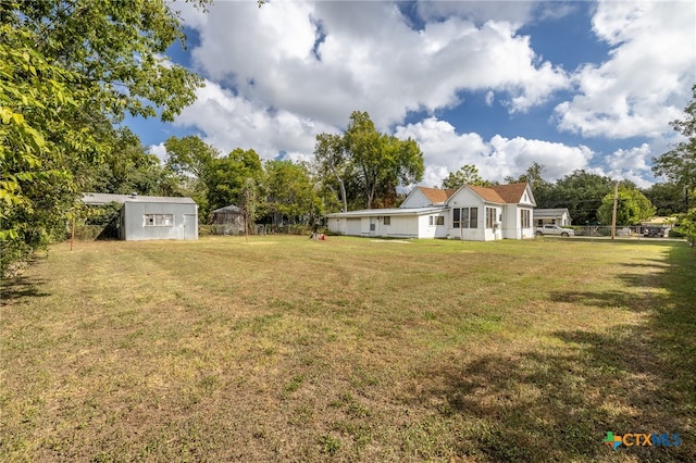 view of yard featuring a storage unit