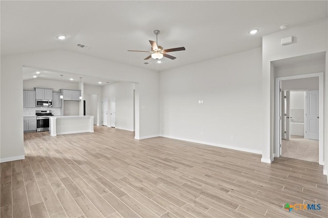 unfurnished living room with lofted ceiling, light hardwood / wood-style floors, and ceiling fan