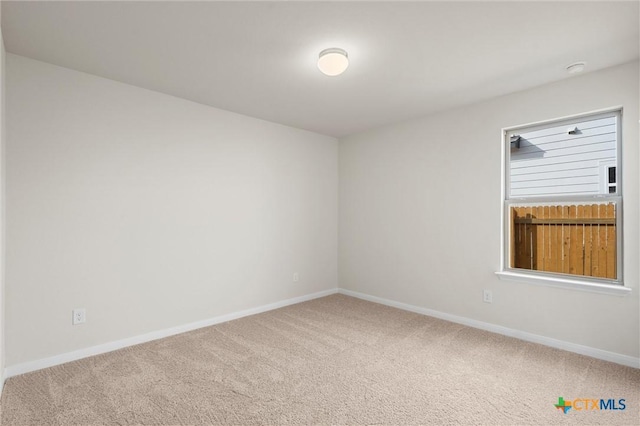 spare room featuring carpet flooring