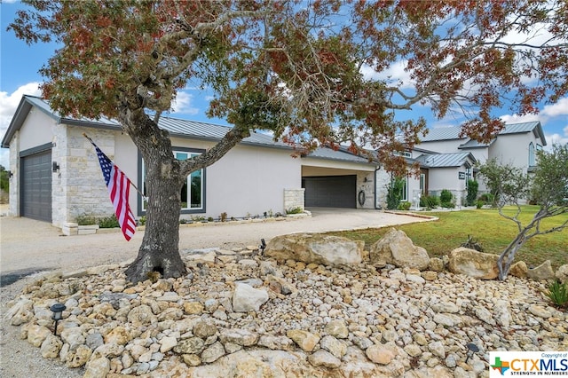 single story home featuring a garage and a front lawn