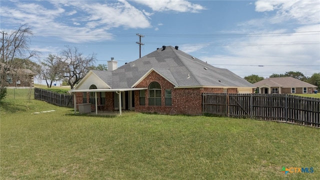 2301 Big Divide Rd, Copperas Cove, TX 76522 - back of property featuring brick siding, a chimney, and roof with shingles