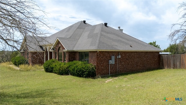 2301 Big Divide Rd, Copperas Cove, TX 76522 - view of home's exterior with brick siding, a chimney, and a shingled roof