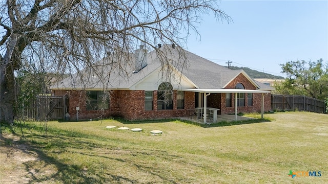 2301 Big Divide Rd, Copperas Cove, TX 76522 - rear view of house featuring a patio, brick siding, and a shingled roof