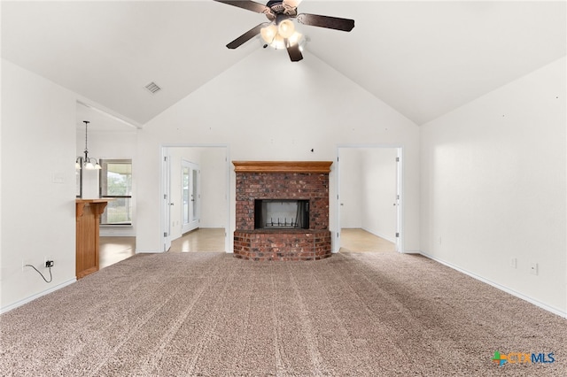 2301 Big Divide Rd, Copperas Cove, TX 76522 - unfurnished living room featuring high vaulted ceiling, ceiling fan, a fireplace, light colored carpet, and baseboards