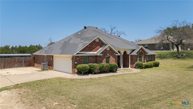 2301 Big Divide Rd, Copperas Cove, TX 76522 - view of front of home with brick siding, a garage, and concrete driveway