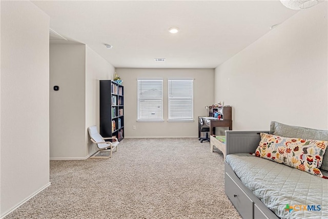 sitting room featuring visible vents, carpet flooring, and baseboards
